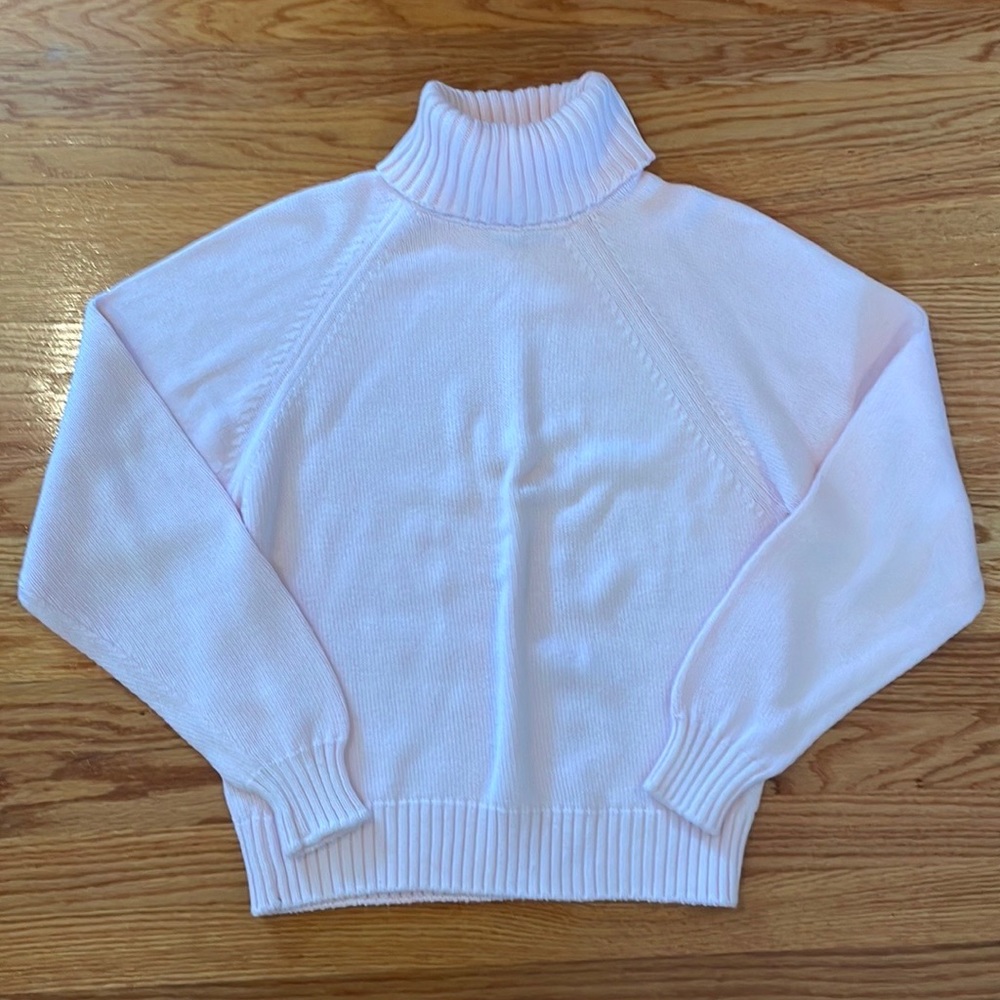 Soft pink turtleneck by The Cotton Collection